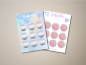 Preview: Zwei Rubbellos-Karten mit neun Rubbelkreisen – links mit silberner Folie, rechts mit roségoldener Folie, beide mit holografischem Rand und Herzdesign